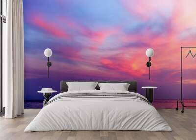 Tropical colorful dramatic sunset with cloudy sky and silhouette of the ship on the horizon. Evening calm on the Gulf of Thailand. Bright afterglow. Wall mural