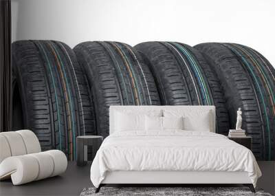 Close-up of four summer car tires isolated on white background Wall mural