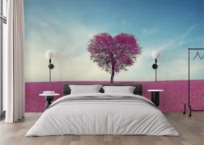 Abstract field with heart shape tree under blue sky. Beauty nature. Valentine concept background Wall mural