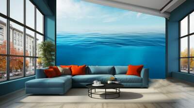 Blue sea or ocean water surface and underwater with sunny and cloudy sky Wall mural