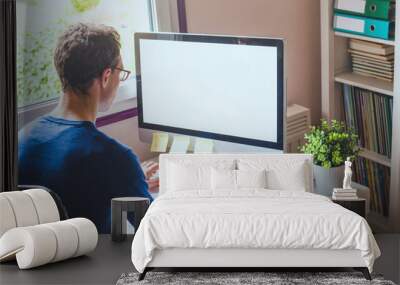 business man working on computer with empty blank screen in office workplace background Wall mural