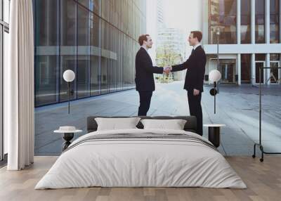 cooperation concept, handshake of two business men Wall mural