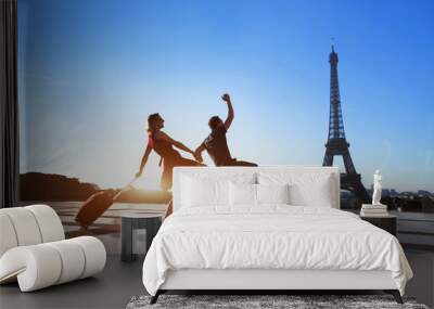 couple of crazy tourists on holidays in paris, man and woman having fun near eiffel tower, travel wi Wall mural