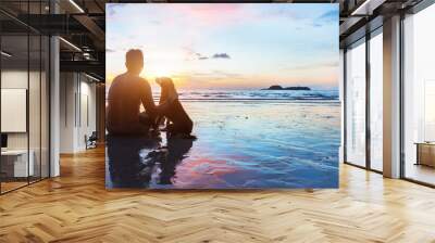 dog and human sitting together on the beach at sunset, friendship, silhouette of man with his dog, banner background with copyspace Wall mural