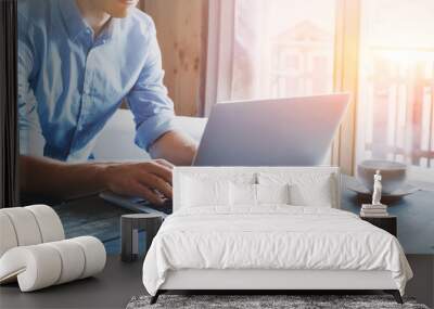 entrepreneur working on laptop online, man using computer at home Wall mural