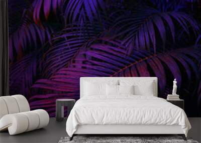 neon light on palm tree leaves, floral background Wall mural