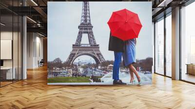 romantic holidays for couple in Paris, honeymoon vacation in France, Europe, man and woman kissing near Eiffel tower Wall mural