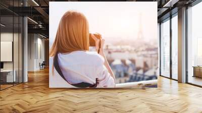 tourist photographer in Paris taking photo of Eiffel tower and panoramic view of the city Wall mural