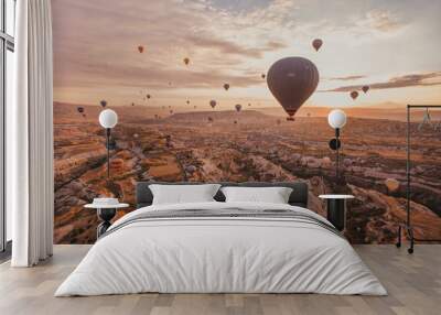 travel and inspiration, hot air ballons in Turkey flying at sunrise sky Wall mural