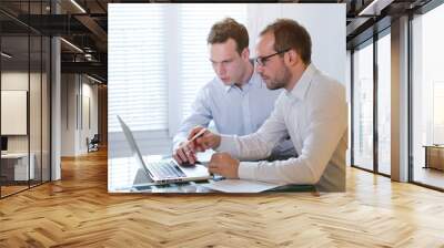 two business men working on laptop, learning new Wall mural