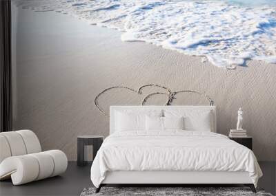 two hearts drawn on perfectly white sand of paradise beach Wall mural