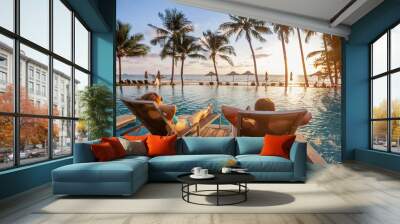 vacation, couple on the beach near swimming pool, luxury travel Wall mural