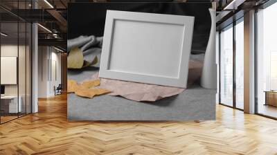 Empty white picture frame with leaves and vase Wall mural