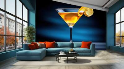 A martini glass with a lemon twist, sparkling liquid under a soft spotlight Wall mural