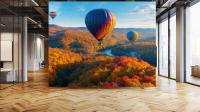 Hot air balloons above a colorful autumn forest, with the trees displaying a brilliant mix of reds, oranges, and yellows Wall mural