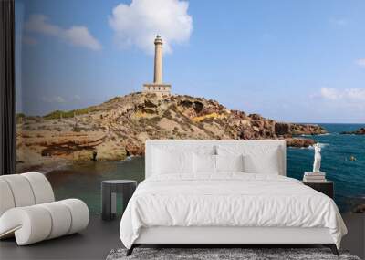 Beautiful Cabo de Palos lighthouse and Cala Fria beach on a sunny day of summer Wall mural