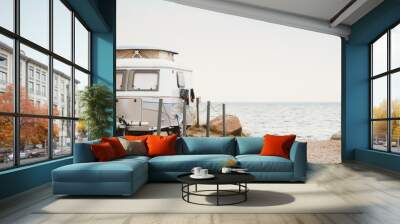 vintage, small, cute caravan directly by the sea, atmospheric  Wall mural