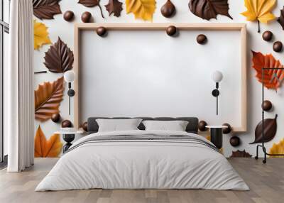 Light wood frame flat lay on the white table with chocolates and leaves Wall mural