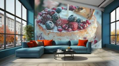   A close-up photo of a cake placed on a plate topped with strawberries and raspberries Wall mural