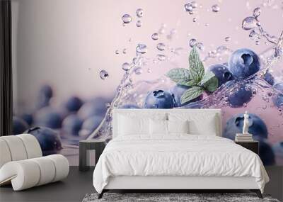   A close-up shot of blueberries submerged in water, with a leaf perched atop one berry and water droplets adorning the other Wall mural