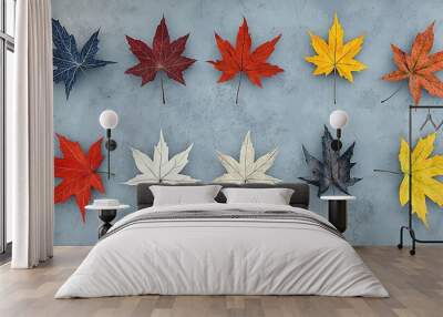   Group of colorful maple leaves on blue-gray background with red, yellow, orange, and green leaves centralized Wall mural