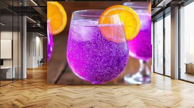   Three close-up glasses of liquid with orange slices on the rims and purple liquid in the middle Wall mural