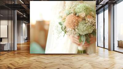  Wedding photo of a woman holding white and pink flowers with greenery Wall mural