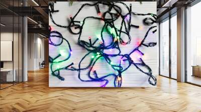 christmas frame of garland lights. colorful stylish border on wh Wall mural