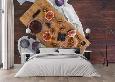 Fresh figs, chocolate and pekan nuts with honey on a wooden boar Wall mural