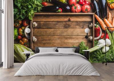 fresh raw ingredients for healthy cooking or salad making with rustic wooden tray in center, top vie Wall mural