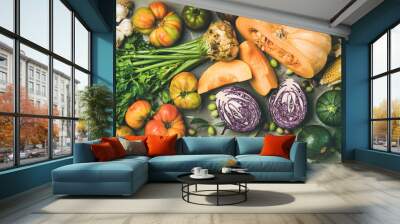 Healthy vegetarian seasonal Fall food cooking background. Flat-lay of Autumn vegetables and herb over grey concrete background, top view, copy space, wide composition. Clean eating, alkaline diet food Wall mural