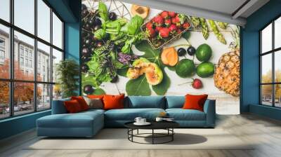 Summer food background. Flat-lay of seasonal fruit, vegetables and greens over white wooden background, top view. Vegetarian, vegan, dieting, clean eating, weight loss ingredients Wall mural