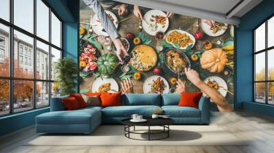 Thanksgiving, Friendsgiving holiday celebration. Flat-lay of friends feasting at Thanksgiving Day table with turkey, pumpkin pie, roasted vegetables, fruit, rose wine, top view Wall mural