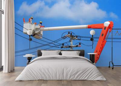 electrician repairing electric power pole on hydraulic platform  Wall mural