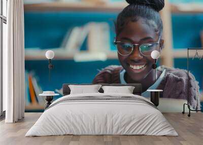 Happy candid african american female school student reading book in classroom library. Inclusive image of a black teenage girl revising studying for exams. Inclusion & diversity in education Wall mural