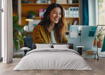 Happy young woman working remotely on virtual video team meeting call, remote work and flexible culture concept, smiling asian female digital nomad freelancing on laptop from home, copy space Wall mural