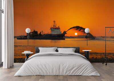 a dredging ship in action at palm jumeirah, dubai, uae Wall mural