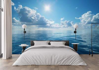 Beautiful ocean view with bright sun and fluffy clouds in blue sky Wall mural