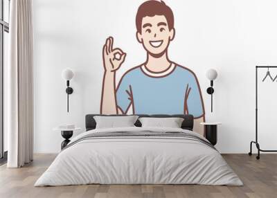 Smiling man holding up his finger as an OK sign. Hand drawn style vector design illustrations.
 Wall mural