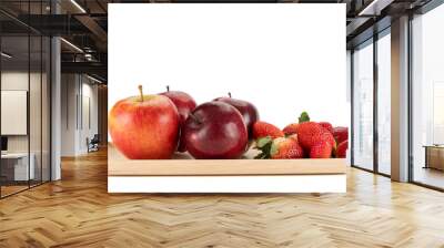 Fresh apples and strawberries on a wooden plate. Wall mural