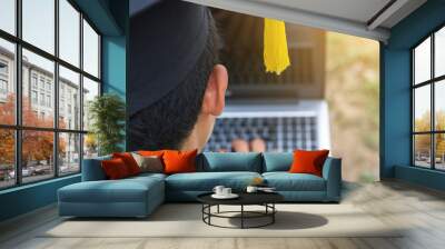 student graduate holding laptop computer with check job Wall mural