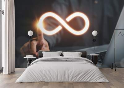 Businessman directs attention to infinity symbol, symbolizing unlimited connection in data technology. Cyber space, future unlimited. Infinite power, energy, internet information. technology infinity Wall mural