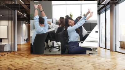 Call center is tired, young adult employee working with headset stretch while working hard, Customer support operator team feeling exhausted and yawning in office, Helpdesk customer services agent Wall mural