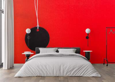 Circle Black tag label on red background Wall mural