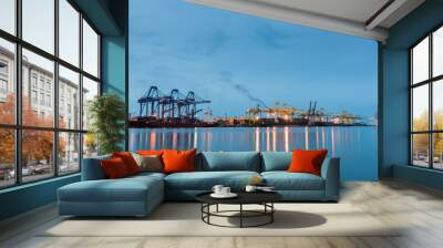 Container Cargo freight ship by crane bridge Wall mural