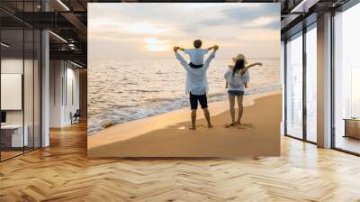 Father carrying son and Mother carrying daughter on shoulder walking summer beach, Parents carrying children on shoulders at beach on sunset, Family on holiday summer vacation, Happy family in holiday Wall mural