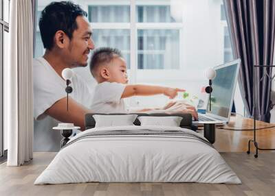 Man father using working on laptop computer Wall mural