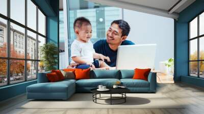 Man father working on laptop computer Wall mural