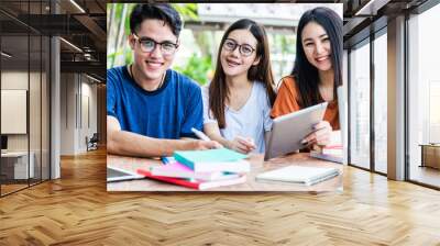 University happy young people students sitting together at table Wall mural