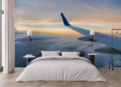 Wing aircraft at cloud sunset Wall mural